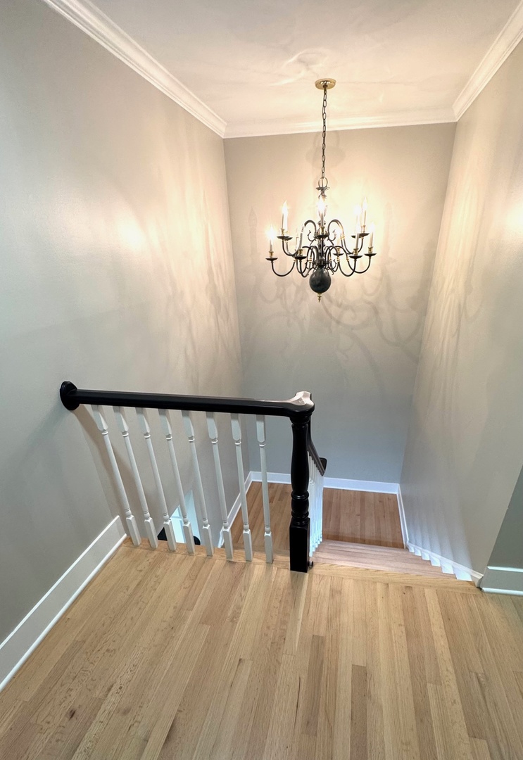 40 Portwine Road Willowbrook, IL 60527 - Photo 20 of 42 a view of a room with a hanging light and hardwood floor