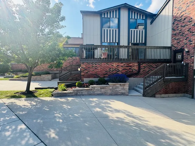 a view of a house with wooden fence
