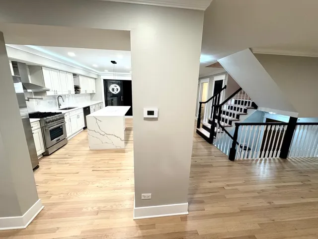 a view of kitchen with sink and microwave