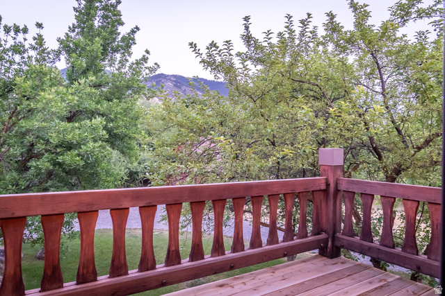 435 Canyon Road Millville, UT 84326 - Photo 79 of 113 Wood-finish deck with a decorative baluster railing