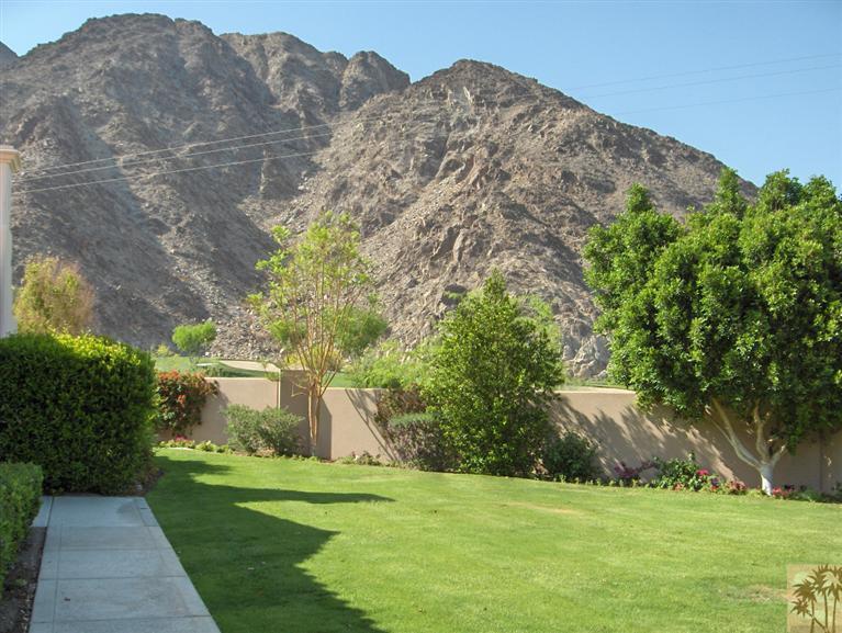 54255 Riviera La Quinta, CA 92253 - Photo 2 of 8 a view of a grassy area with an trees