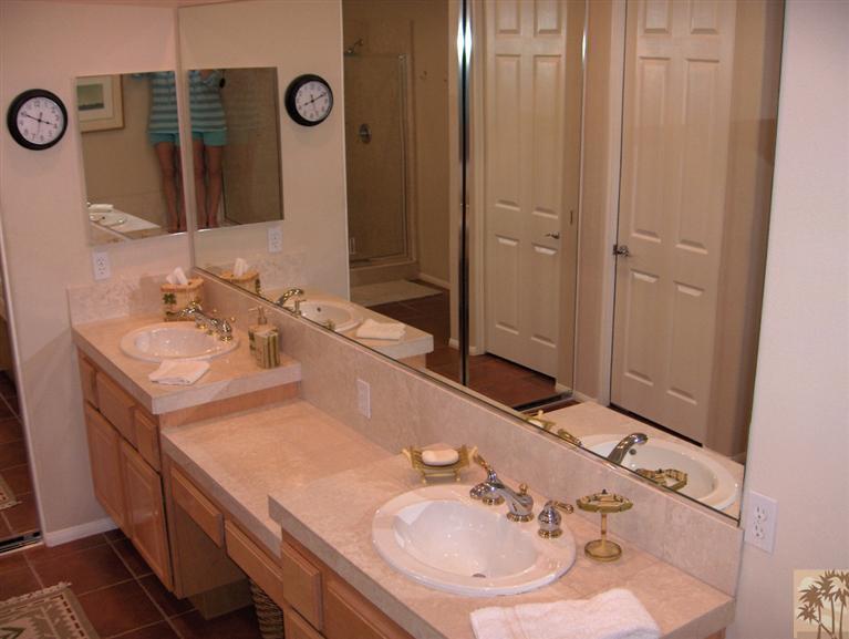 54255 Riviera La Quinta, CA 92253 - Photo 7 of 8 a bathroom with a sink and a mirror