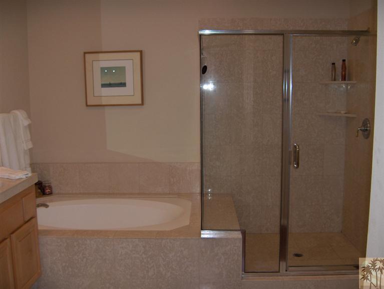 54255 Riviera La Quinta, CA 92253 - Photo 8 of 8 a bathroom with a shower and a bath tub