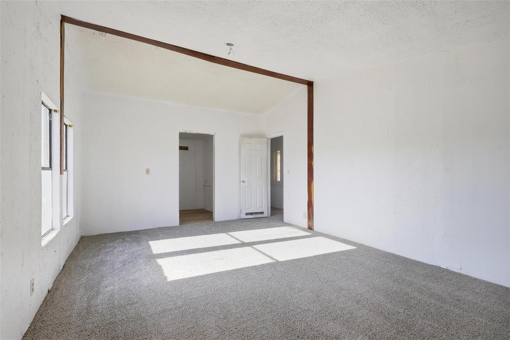 1491 County Road 319, Unit B Cleburne, TX 76033 - Photo 13 of 24 an empty room with windows