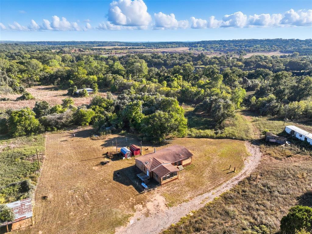 1491 County Road 319, Unit B Cleburne, TX 76033 - Photo 20 of 24 a view of a lake with a mountain
