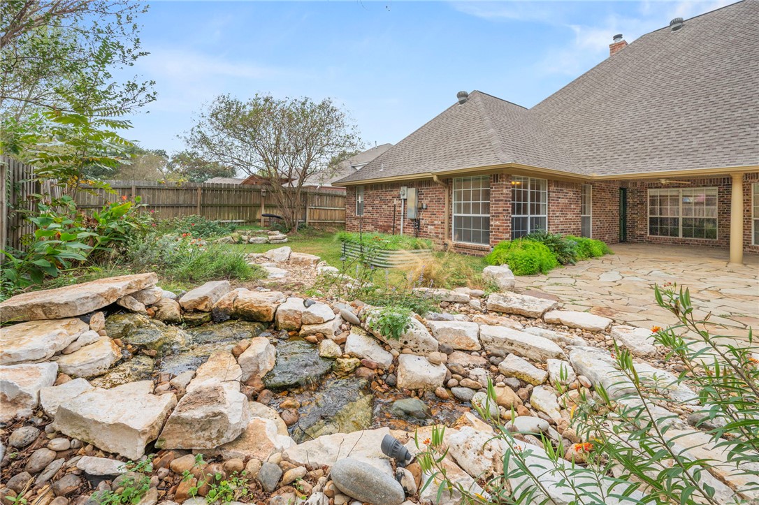 713 Willow Loop College Station, TX 77845 - Photo 37 of 39 a front view of house with yard and trees around