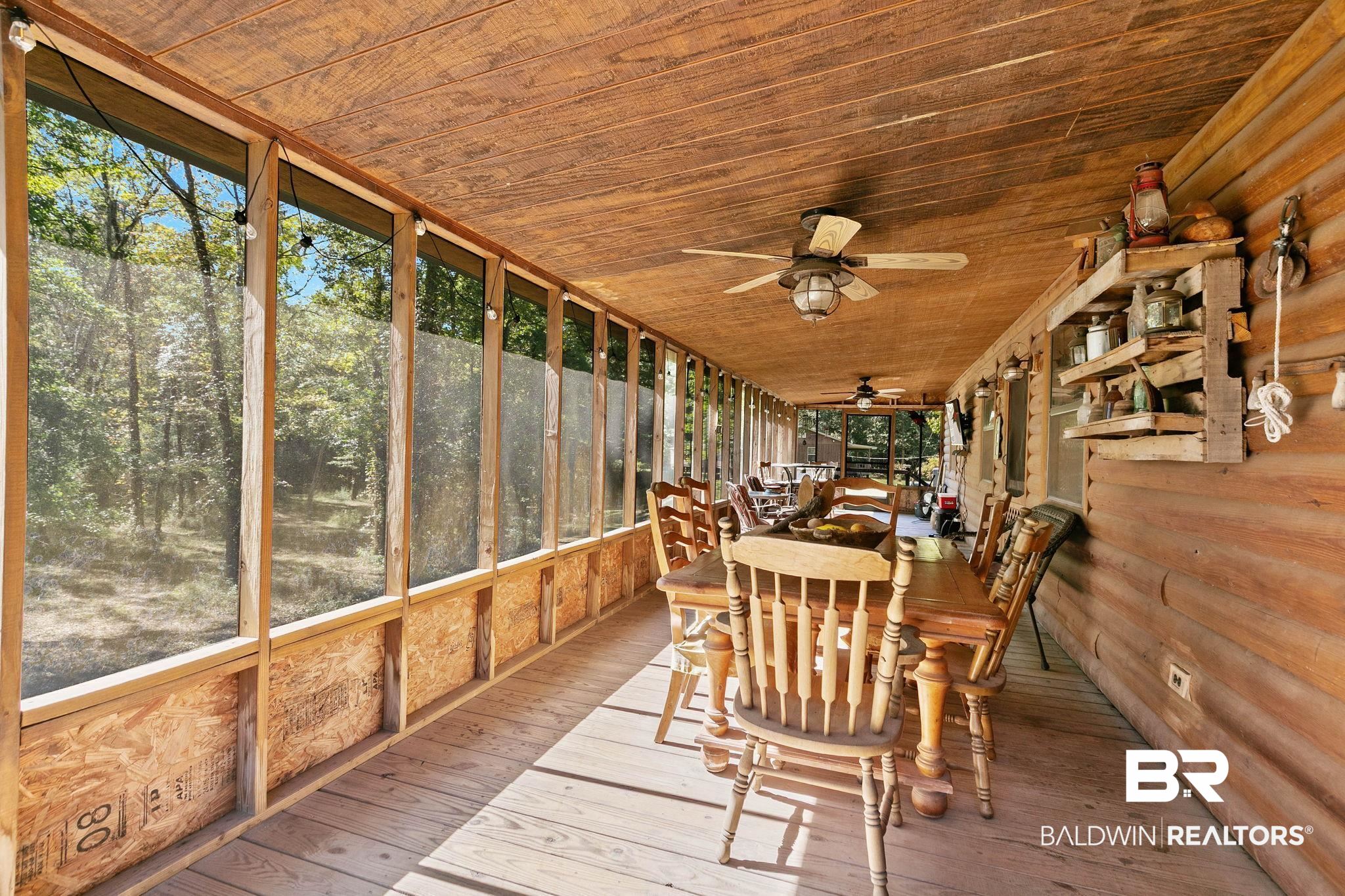 724 Rowell Lane Brewton, AL 36426 - Photo 25 of 40 Sunroom / solarium featuring a ceiling fan and outdoor dining space