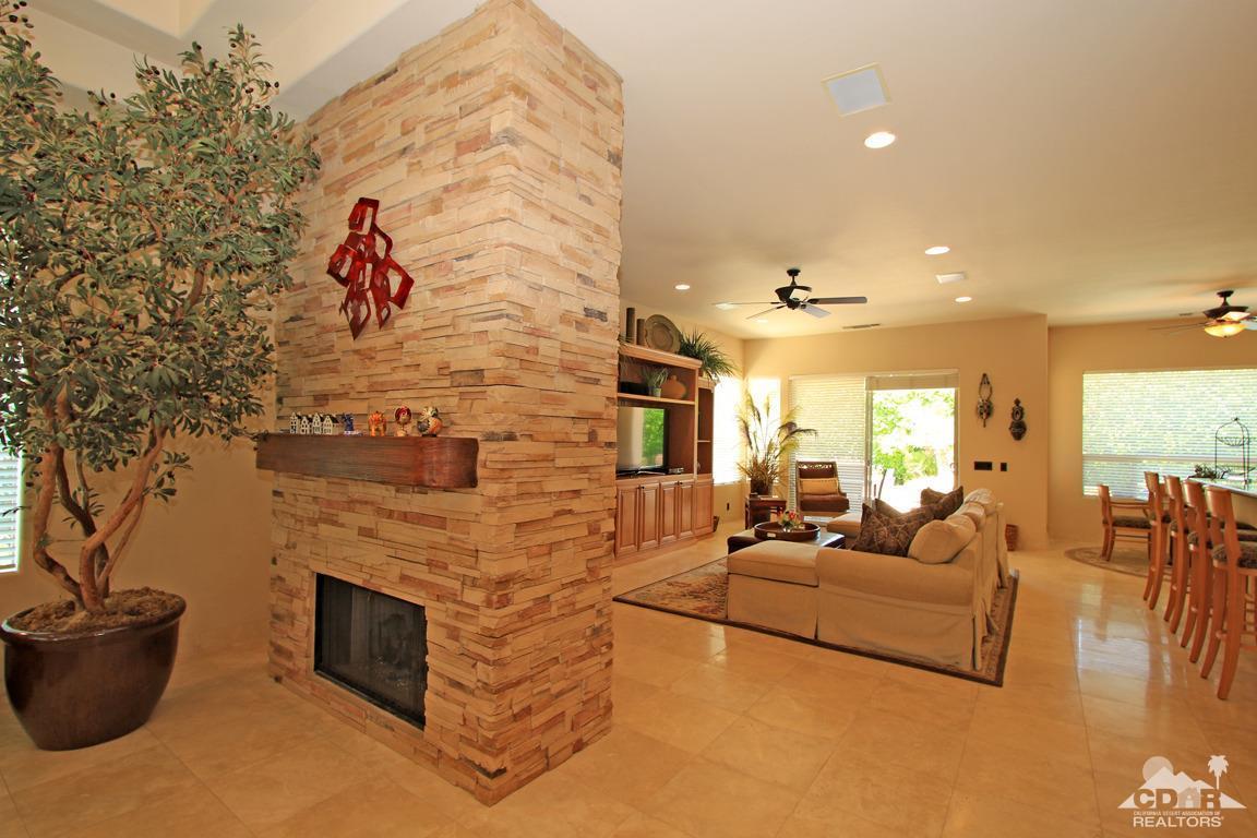4 Mesquite Ridge Lane Rancho Mirage, CA 92270 - Photo 11 of 62 a living room with furniture a flat screen tv and a fireplace