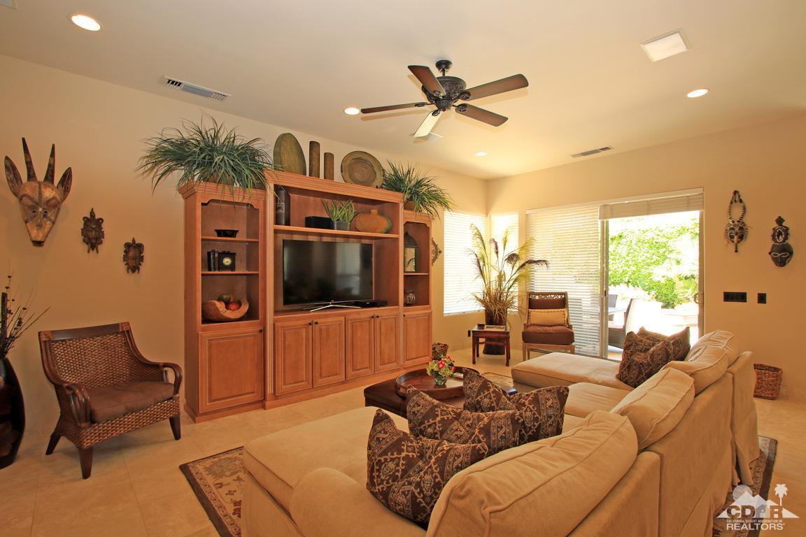 4 Mesquite Ridge Lane Rancho Mirage, CA 92270 - Photo 16 of 62 a living room with furniture ceiling fan and a flat screen tv