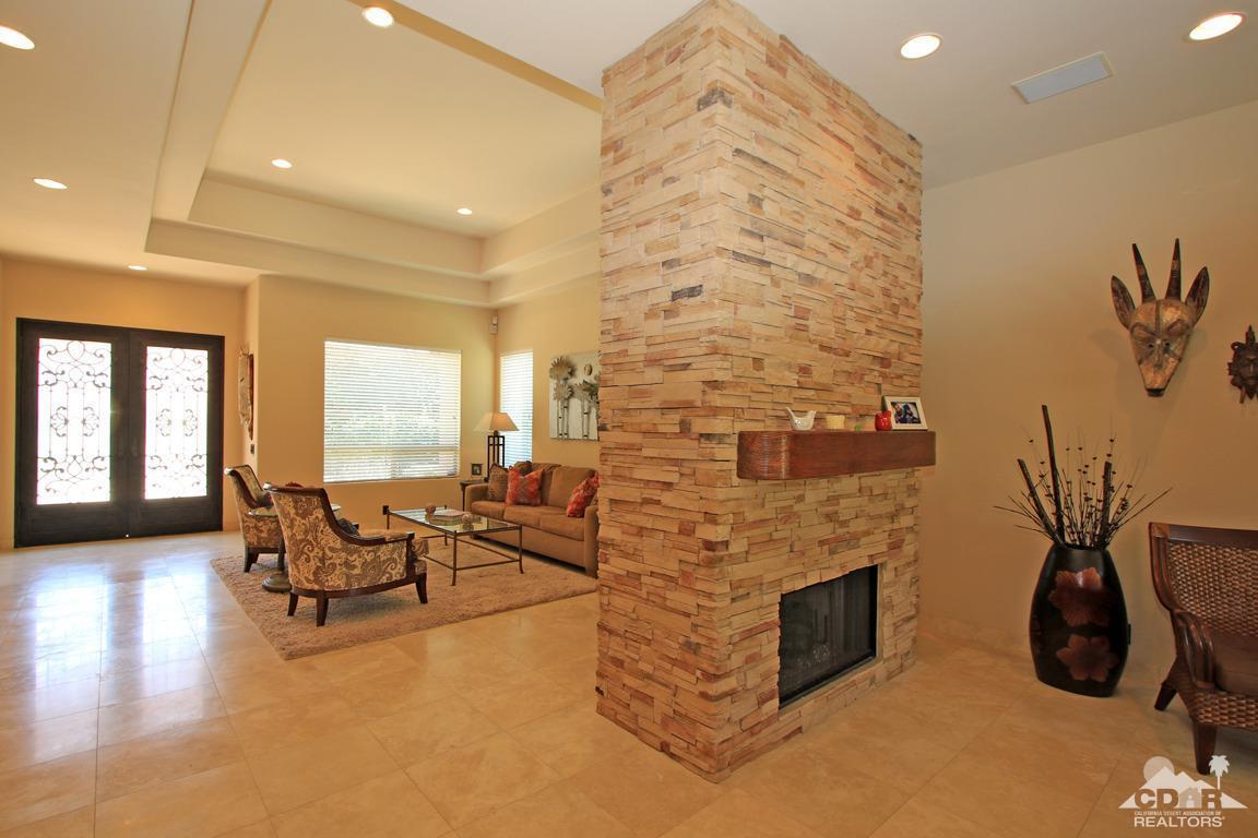 4 Mesquite Ridge Lane Rancho Mirage, CA 92270 - Photo 17 of 62 a living room with fireplace furniture and a flat screen tv