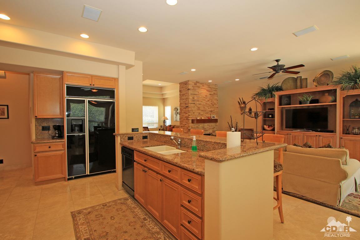 4 Mesquite Ridge Lane Rancho Mirage, CA 92270 - Photo 22 of 62 a view of a kitchen with a sink and a refrigerator