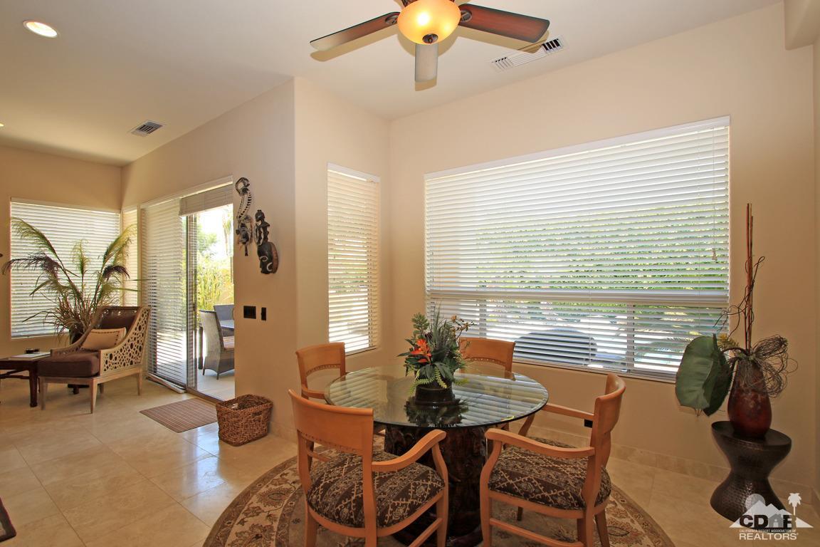 4 Mesquite Ridge Lane Rancho Mirage, CA 92270 - Photo 24 of 62 a living room with furniture and floor to ceiling window