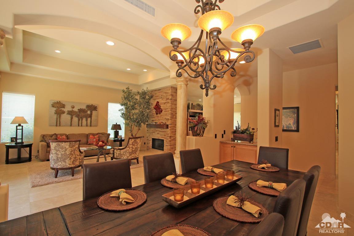 4 Mesquite Ridge Lane Rancho Mirage, CA 92270 - Photo 29 of 62 a living room with furniture and a chandelier