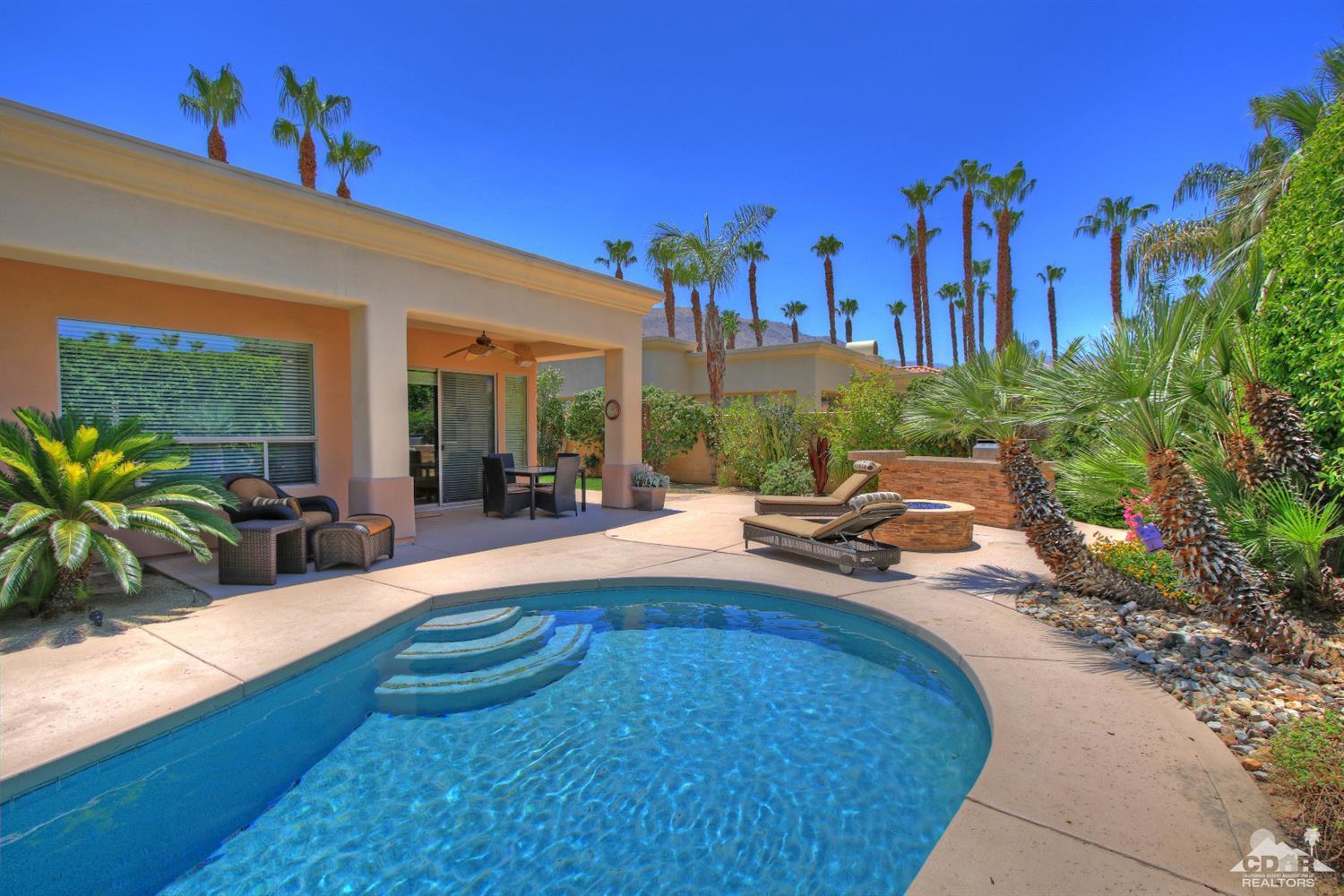 4 Mesquite Ridge Lane Rancho Mirage, CA 92270 - Photo 3 of 62 a swimming pool with outdoor seating and yard