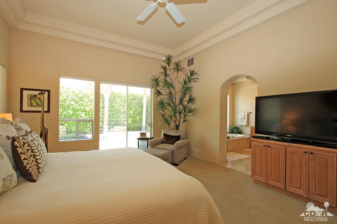 4 Mesquite Ridge Lane Rancho Mirage, CA 92270 - Photo 31 of 62 a bedroom with a bed and a flat screen tv