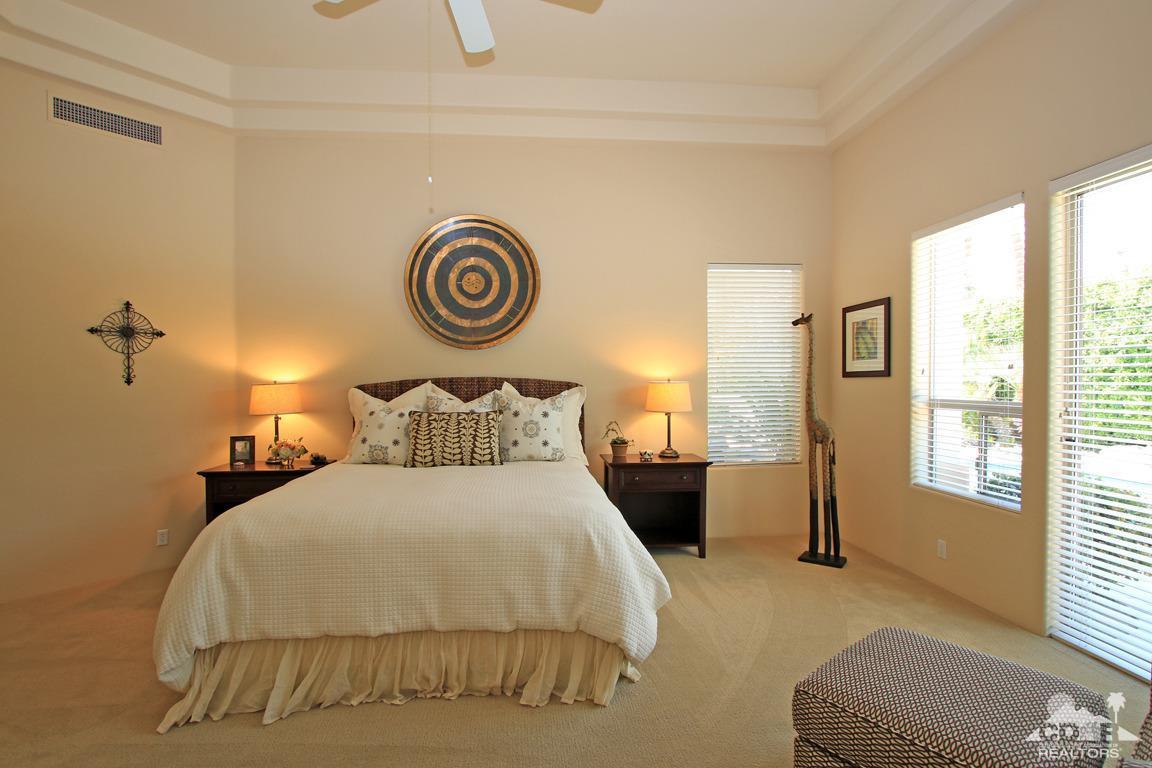 4 Mesquite Ridge Lane Rancho Mirage, CA 92270 - Photo 34 of 62 a bedroom with a bed and a window
