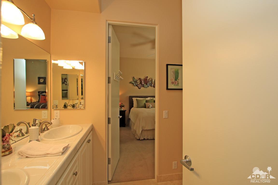 4 Mesquite Ridge Lane Rancho Mirage, CA 92270 - Photo 40 of 62 a en suite bathroom with a sink and mirror