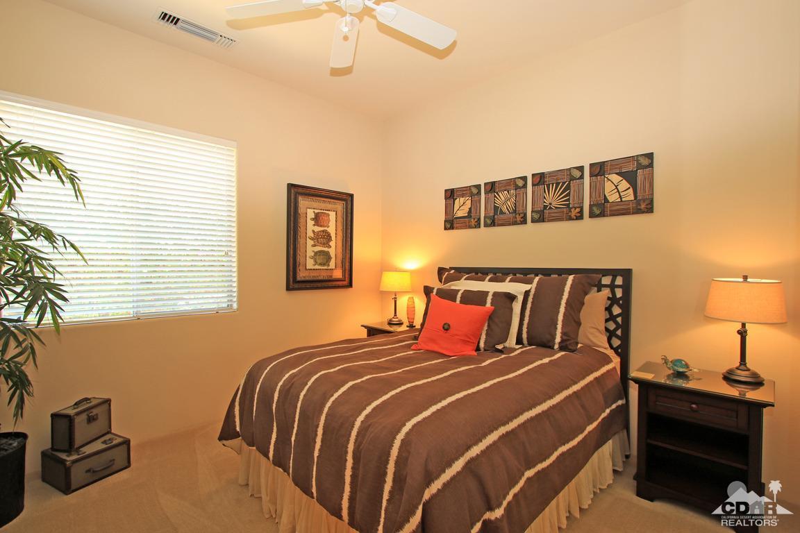 4 Mesquite Ridge Lane Rancho Mirage, CA 92270 - Photo 41 of 62 a bedroom with a bed and a lamp on the dresser