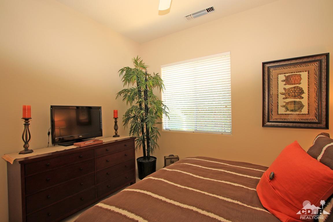 4 Mesquite Ridge Lane Rancho Mirage, CA 92270 - Photo 43 of 62 a bedroom with a bed and a flat screen tv