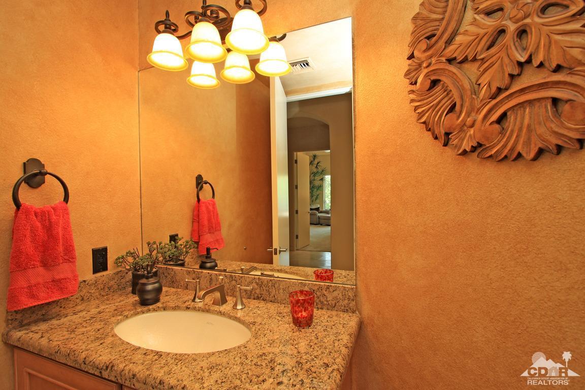 4 Mesquite Ridge Lane Rancho Mirage, CA 92270 - Photo 44 of 62 a bathroom with a sink and a mirror