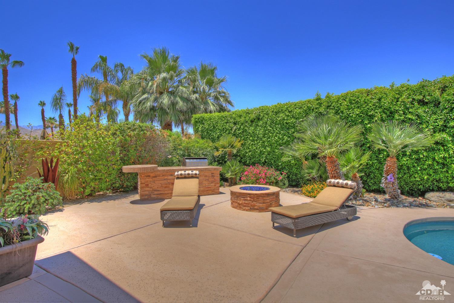 4 Mesquite Ridge Lane Rancho Mirage, CA 92270 - Photo 50 of 62 a view of patio with couches and a fire pit