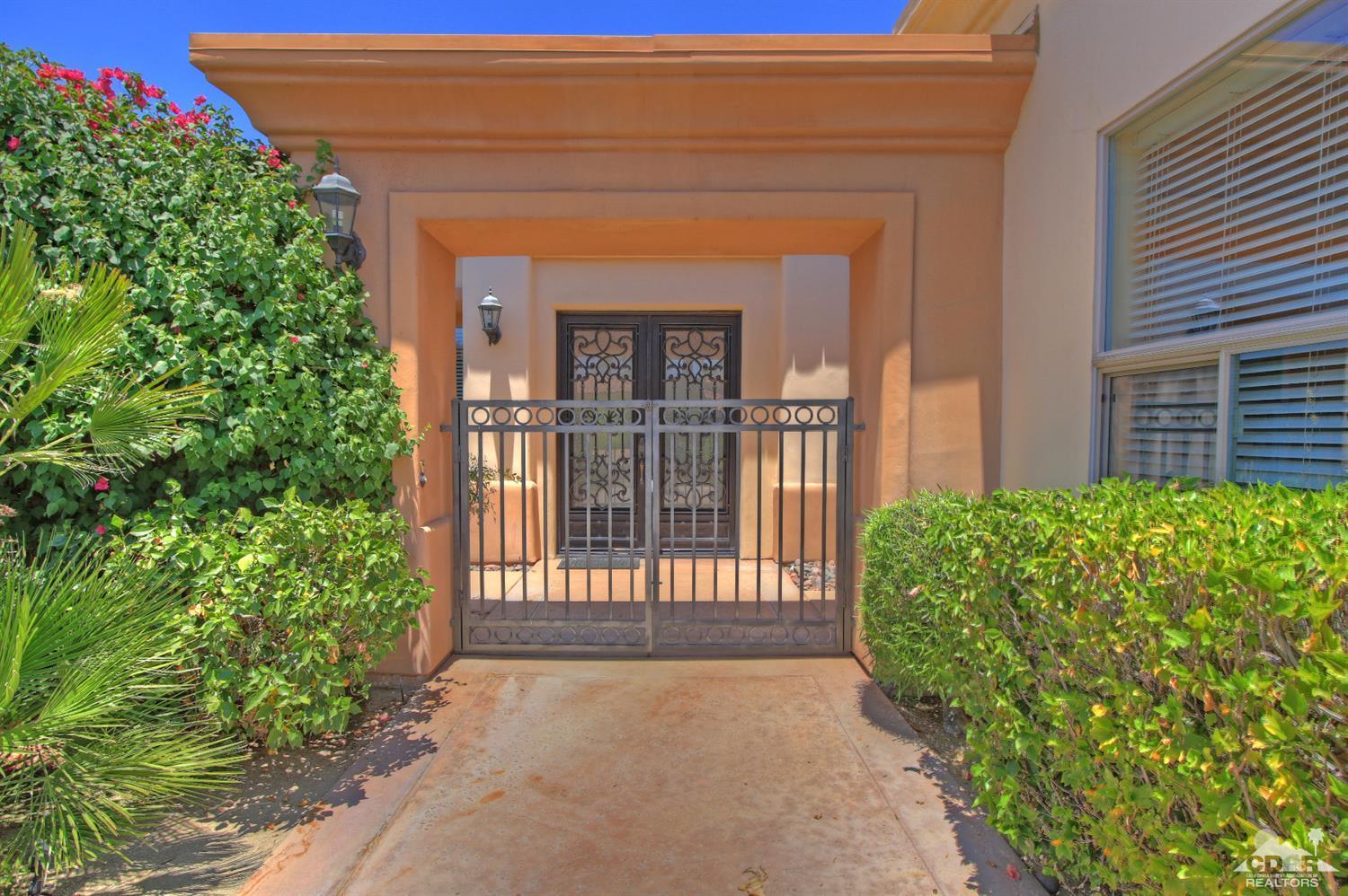 4 Mesquite Ridge Lane Rancho Mirage, CA 92270 - Photo 5 of 62 front view of a house with a porch