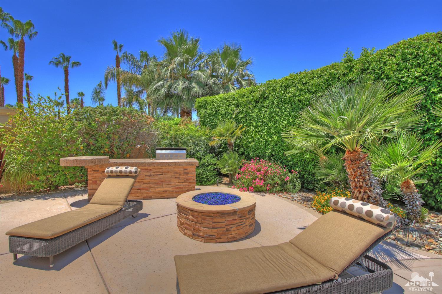 4 Mesquite Ridge Lane Rancho Mirage, CA 92270 - Photo 54 of 62 a view of a patio with chairs and potted plants