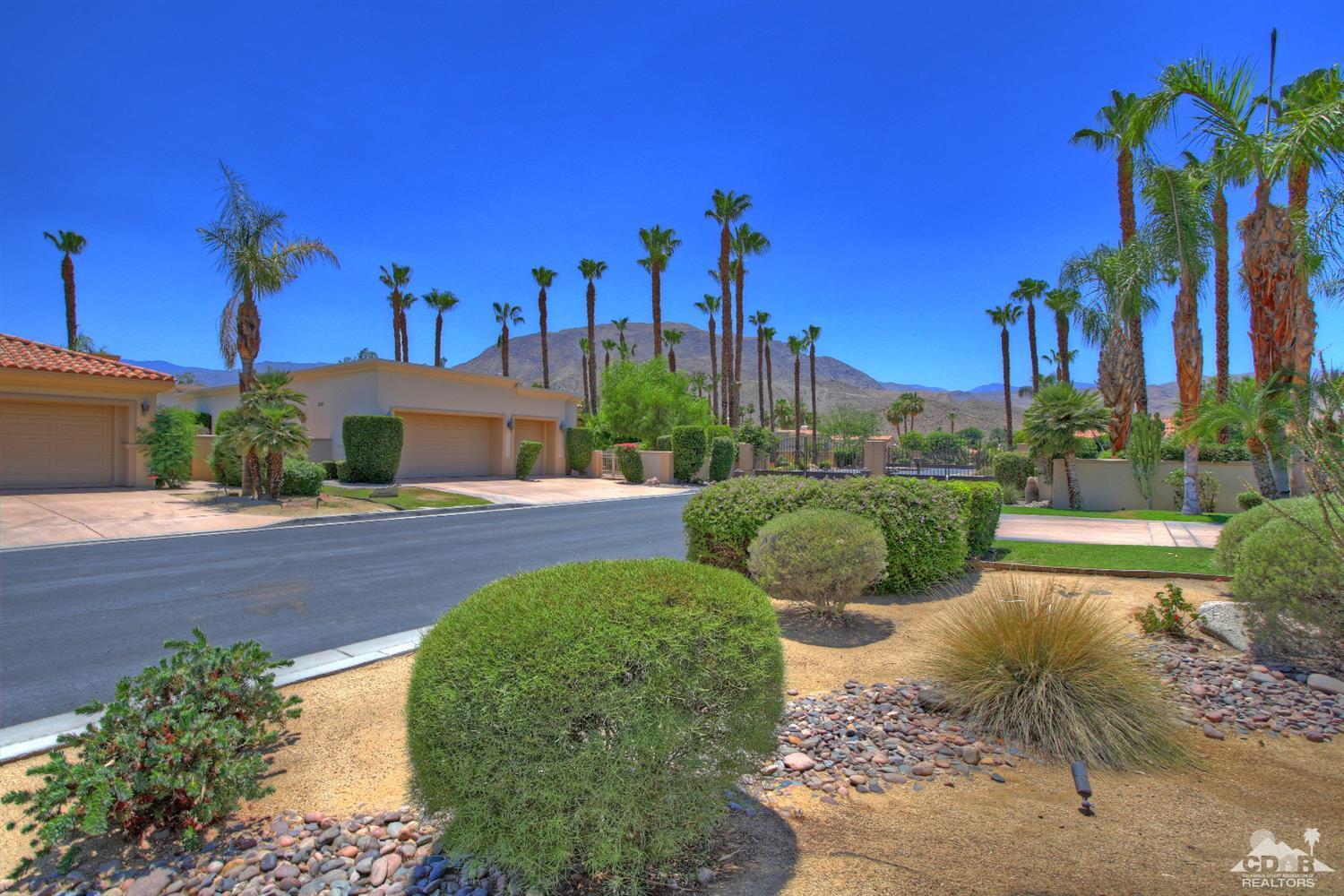4 Mesquite Ridge Lane Rancho Mirage, CA 92270 - Photo 60 of 62 a view of a garden with a houses