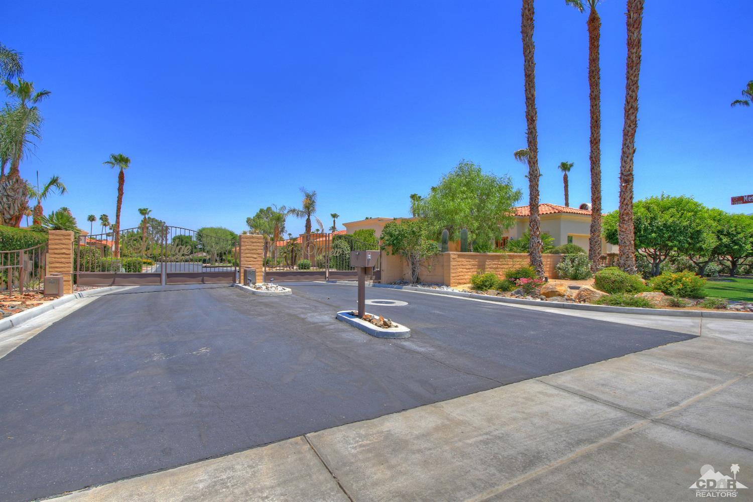 4 Mesquite Ridge Lane Rancho Mirage, CA 92270 - Photo 61 of 62 a view of a street with a house