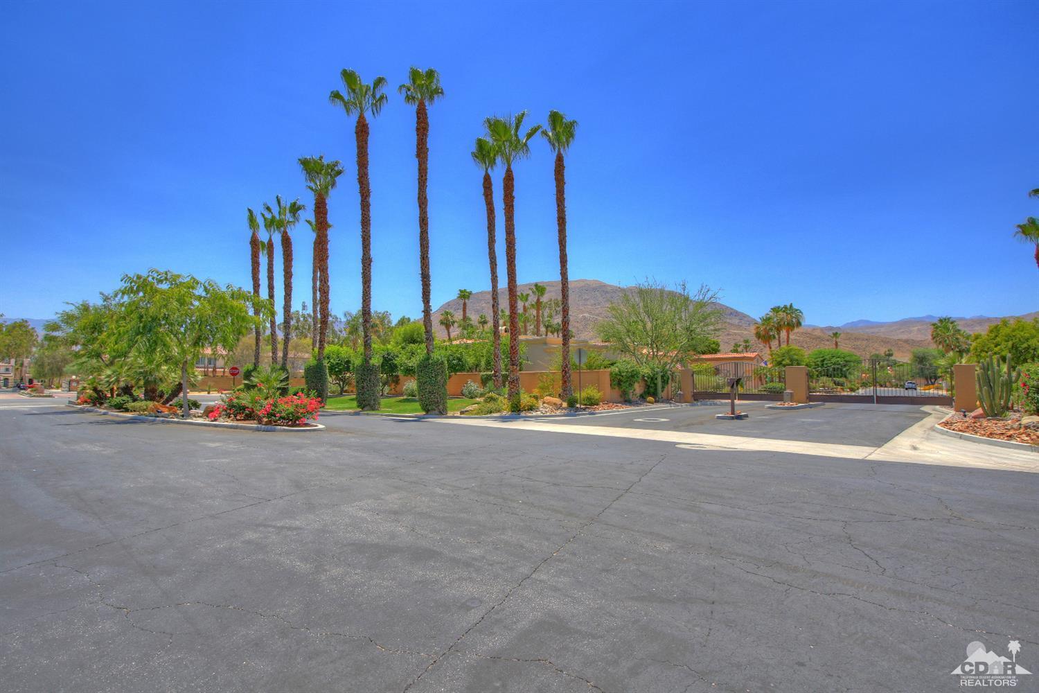 4 Mesquite Ridge Lane Rancho Mirage, CA 92270 - Photo 62 of 62 a view of a road with a building and a big yard