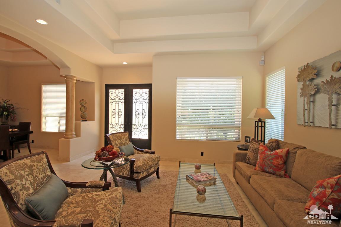 4 Mesquite Ridge Lane Rancho Mirage, CA 92270 - Photo 9 of 62 a living room with furniture and a large window