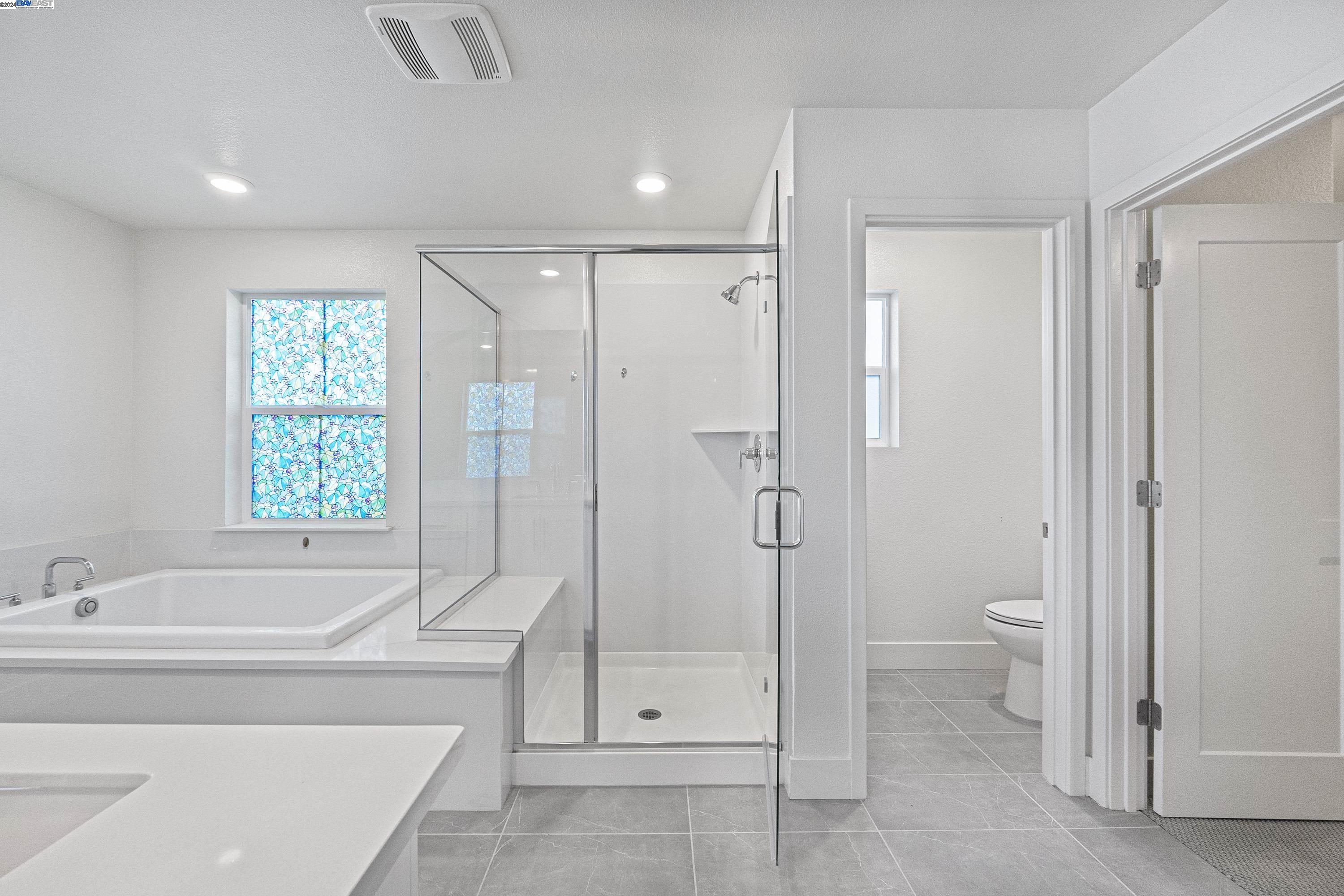 9657 Pontoon Way Newark, CA 94560 - Photo 16 of 46 a spacious bathroom with a shower toilet and a sink