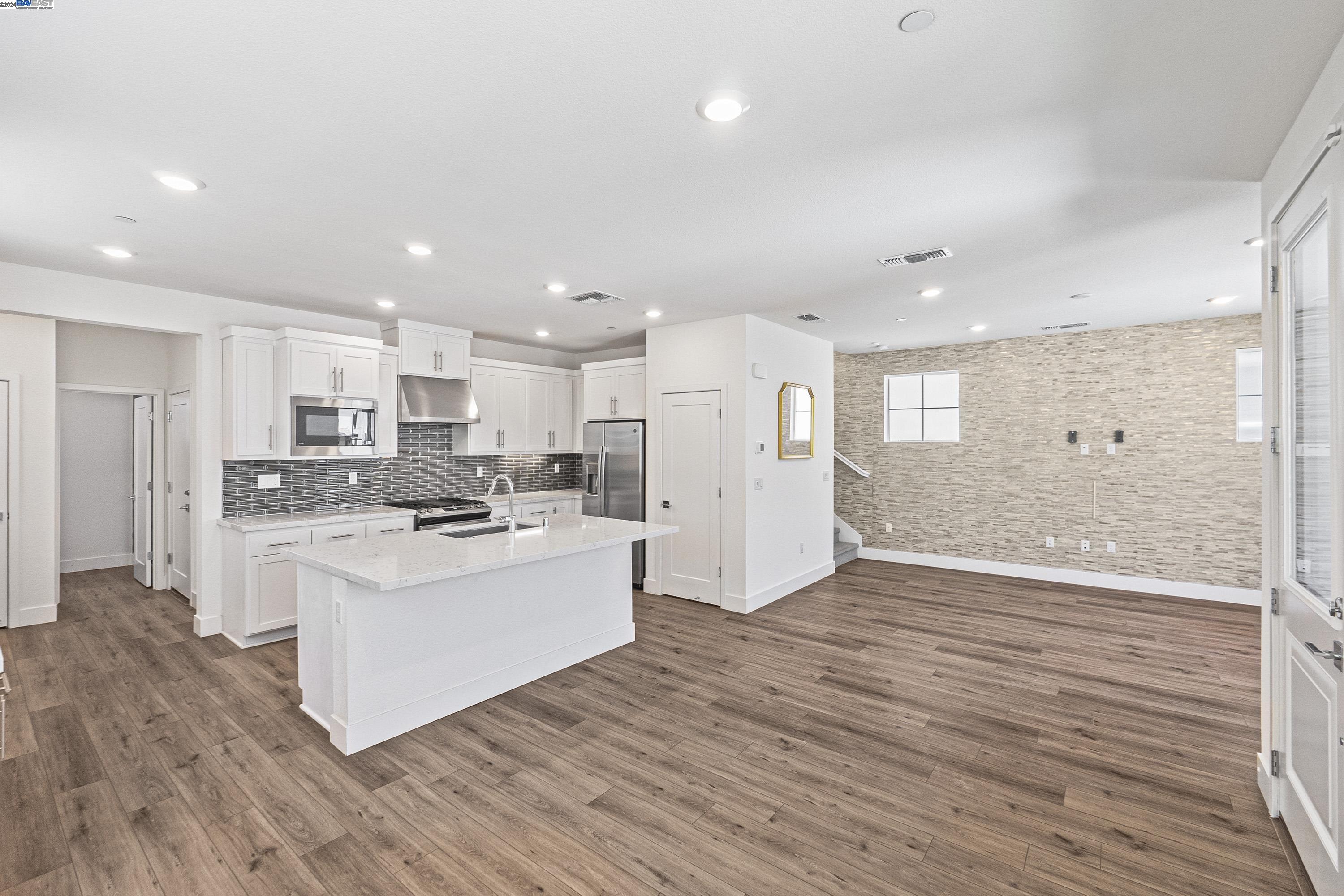 9657 Pontoon Way Newark, CA 94560 - Photo 2 of 46 a view of kitchen with wooden floor and electronic appliances