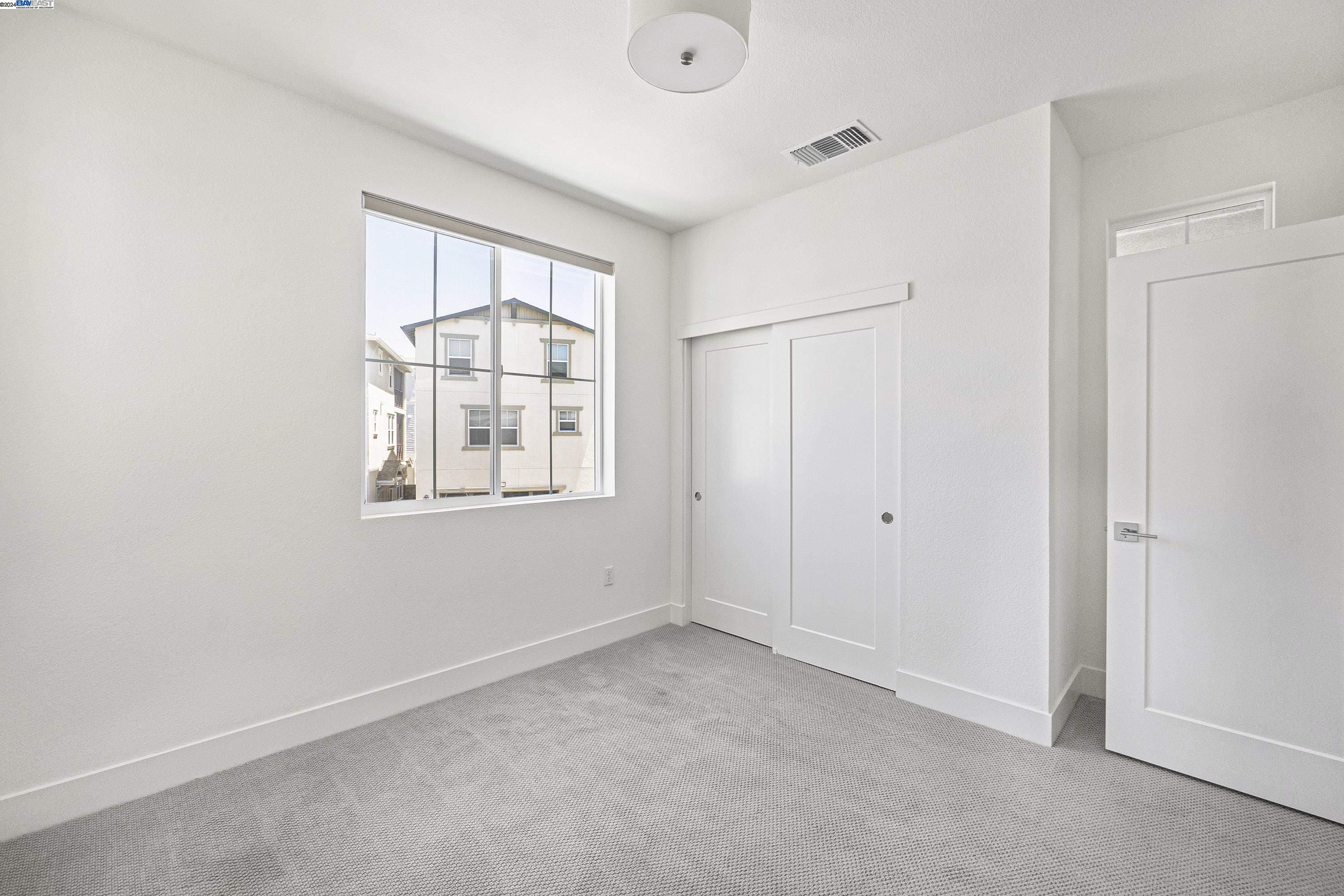 9657 Pontoon Way Newark, CA 94560 - Photo 23 of 46 a view of an empty room with a window