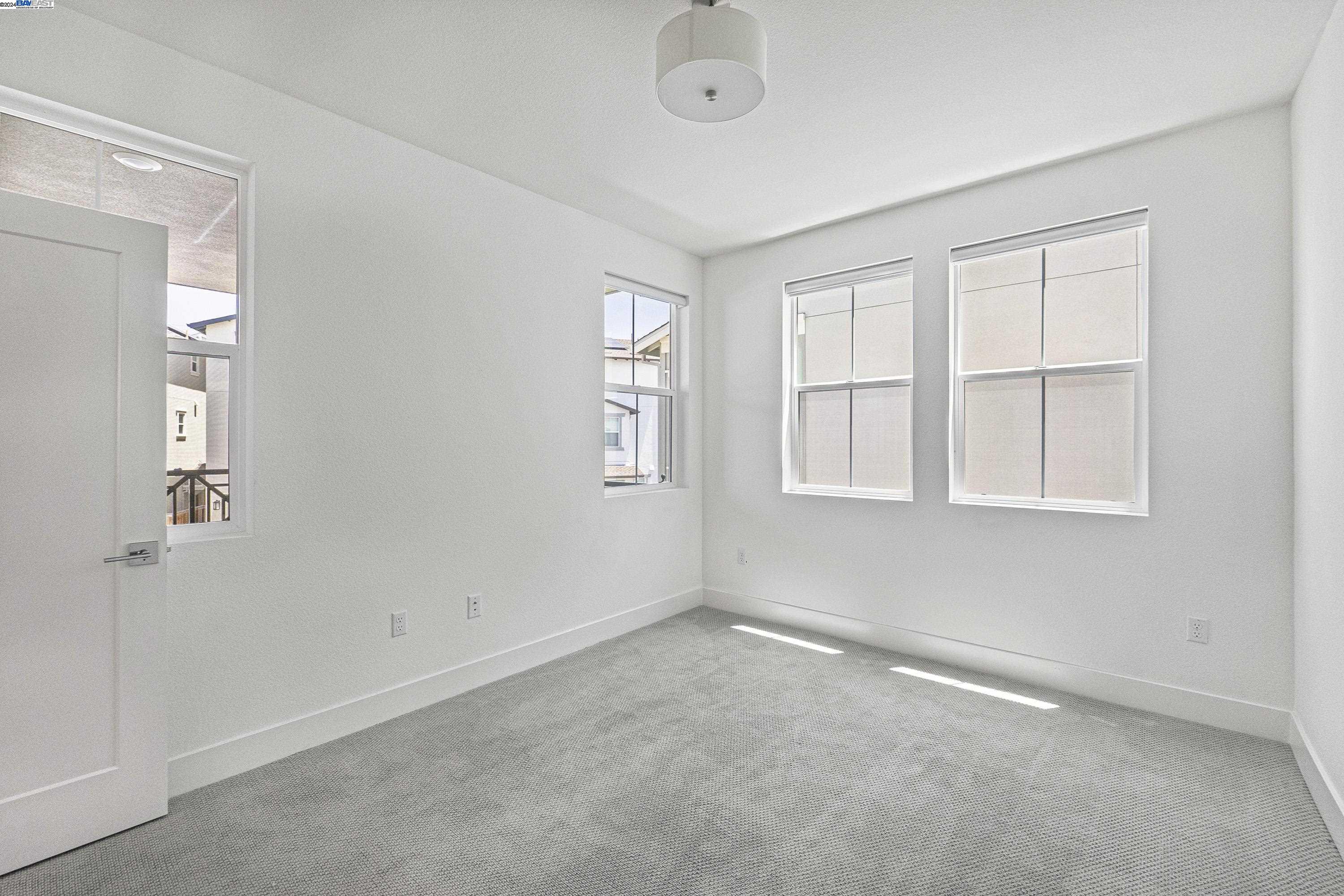 9657 Pontoon Way Newark, CA 94560 - Photo 25 of 46 an empty room with windows