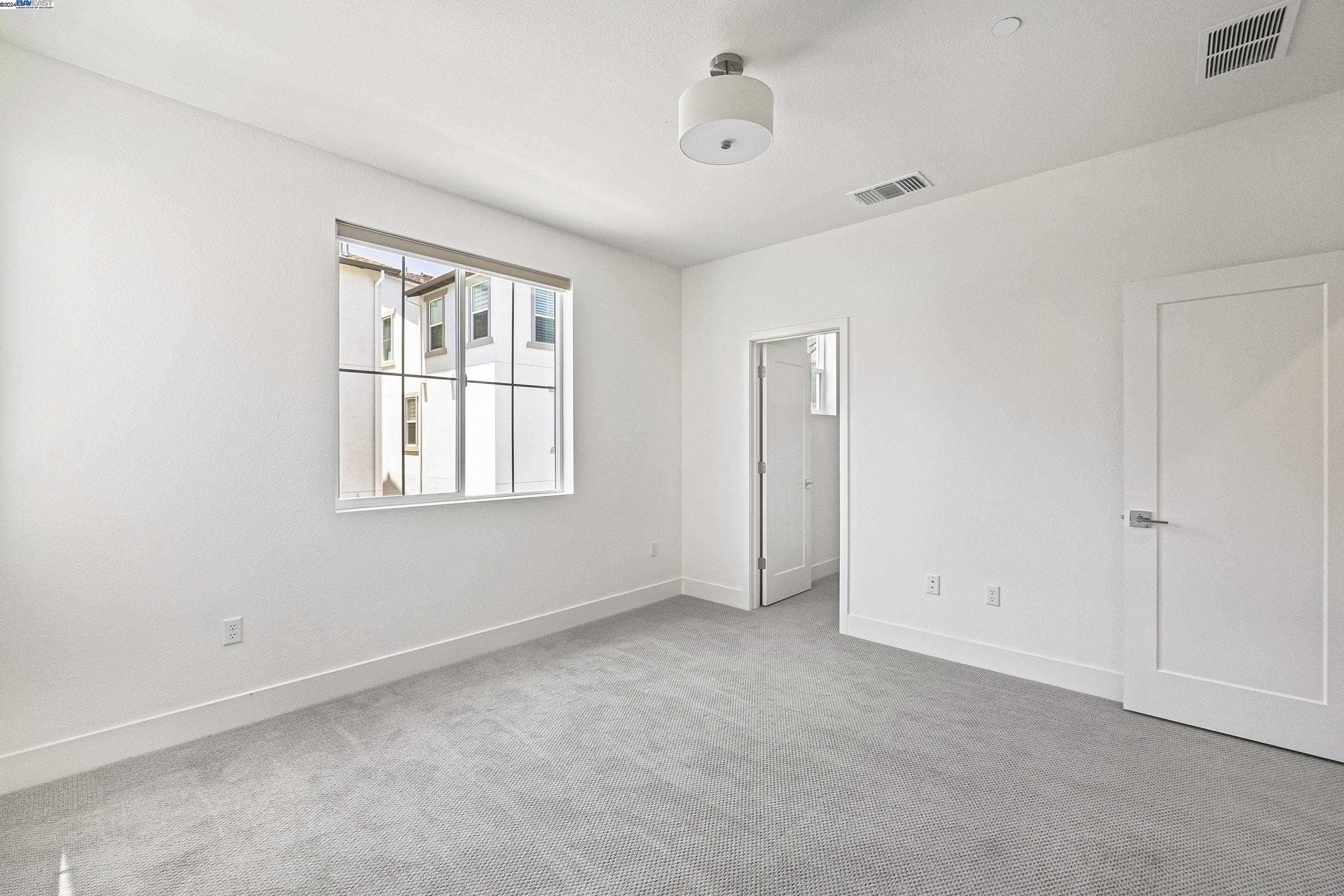 9657 Pontoon Way Newark, CA 94560 - Photo 28 of 46 a view of an empty room with a window