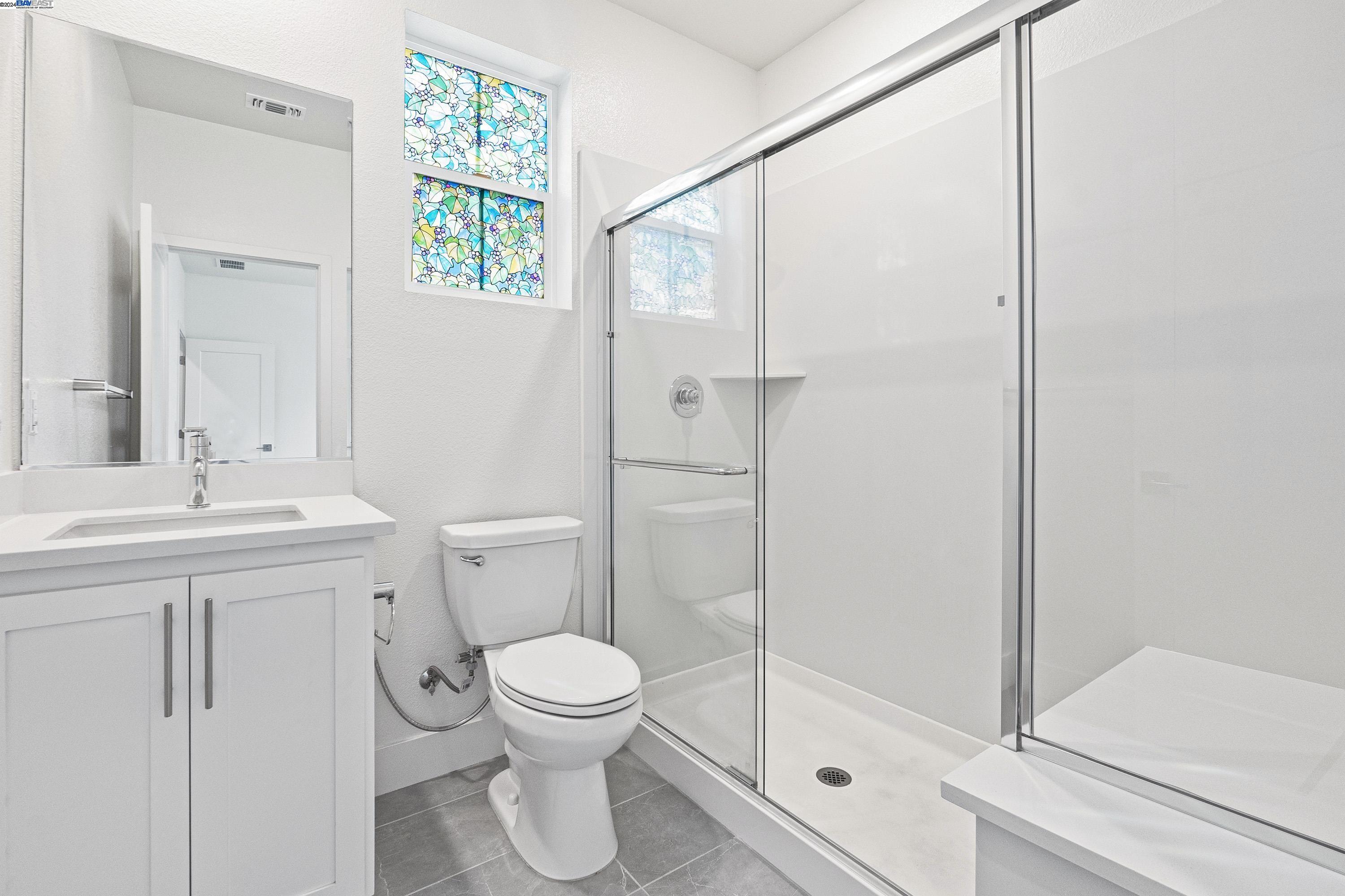 9657 Pontoon Way Newark, CA 94560 - Photo 31 of 46 a bathroom with a toilet a sink and a shower