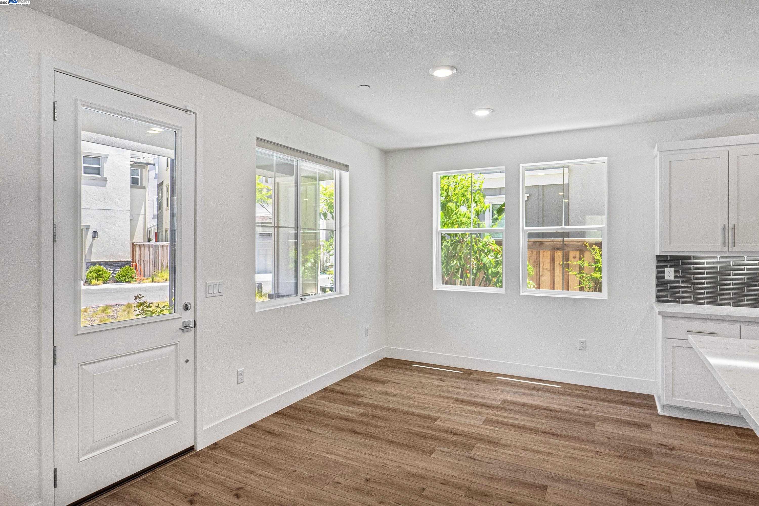 9657 Pontoon Way Newark, CA 94560 - Photo 8 of 46 a view of an empty room with window and wooden floor