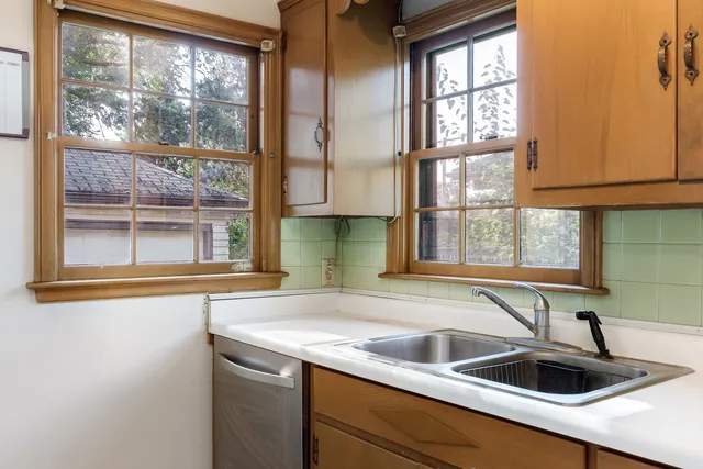 a kitchen with a sink and a window