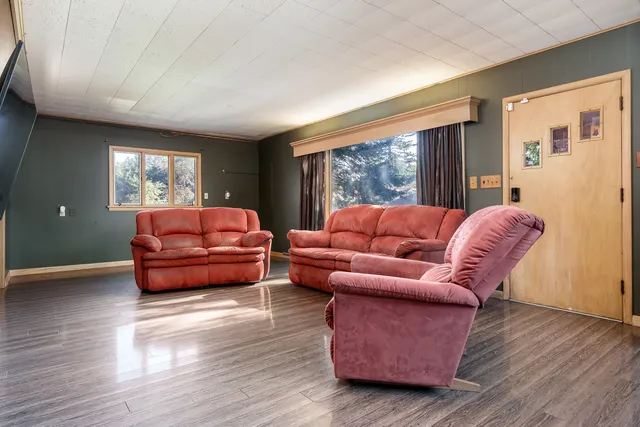 a living room with furniture and a window