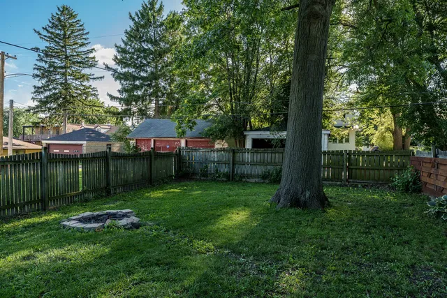 a view of a backyard with a small pool