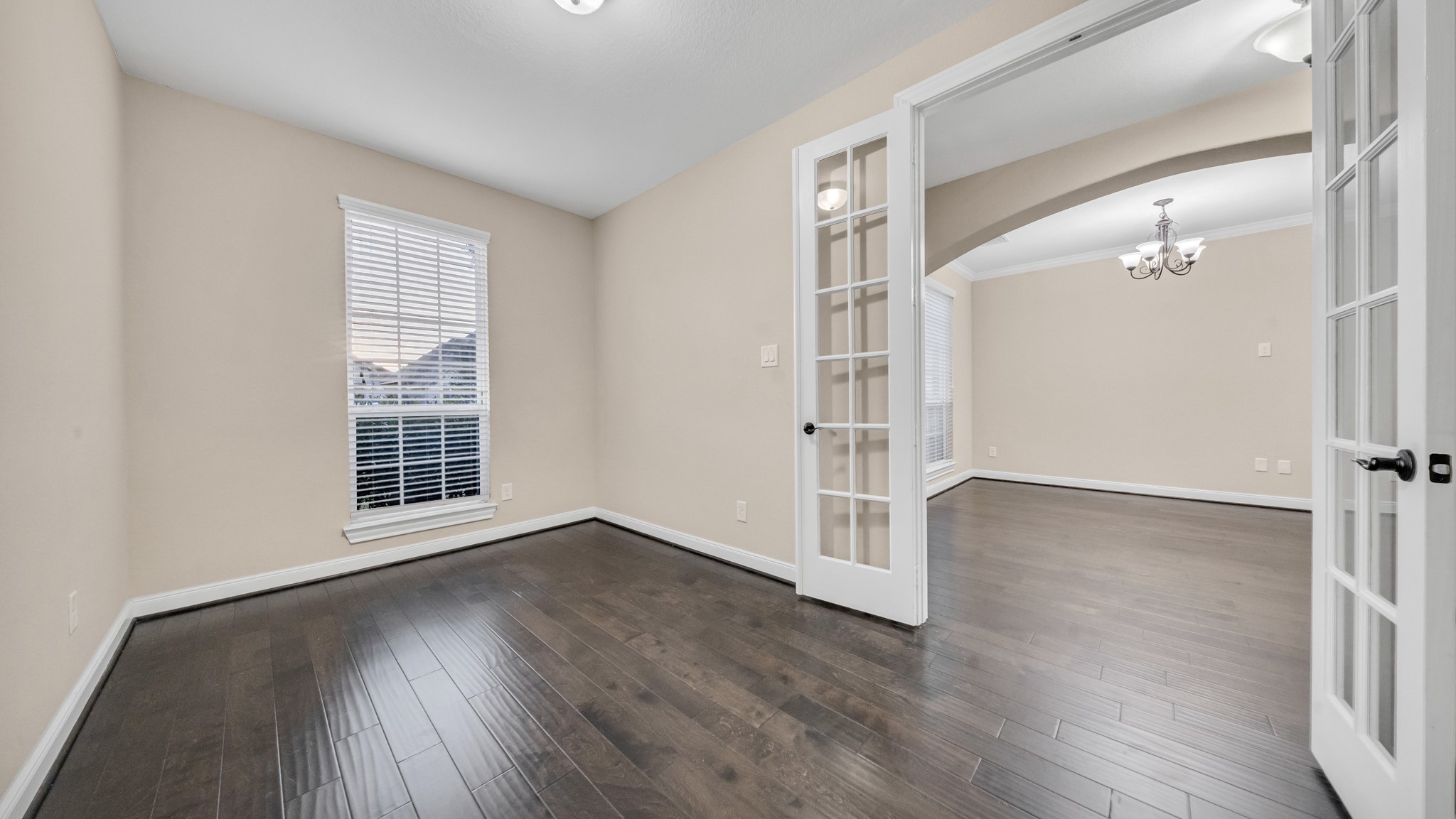 18118 Berry Garden Lane Spring, TX 77379 - Photo 7 of 45 Private study with French doors and wood flooring—perfect for a home office or flex space.