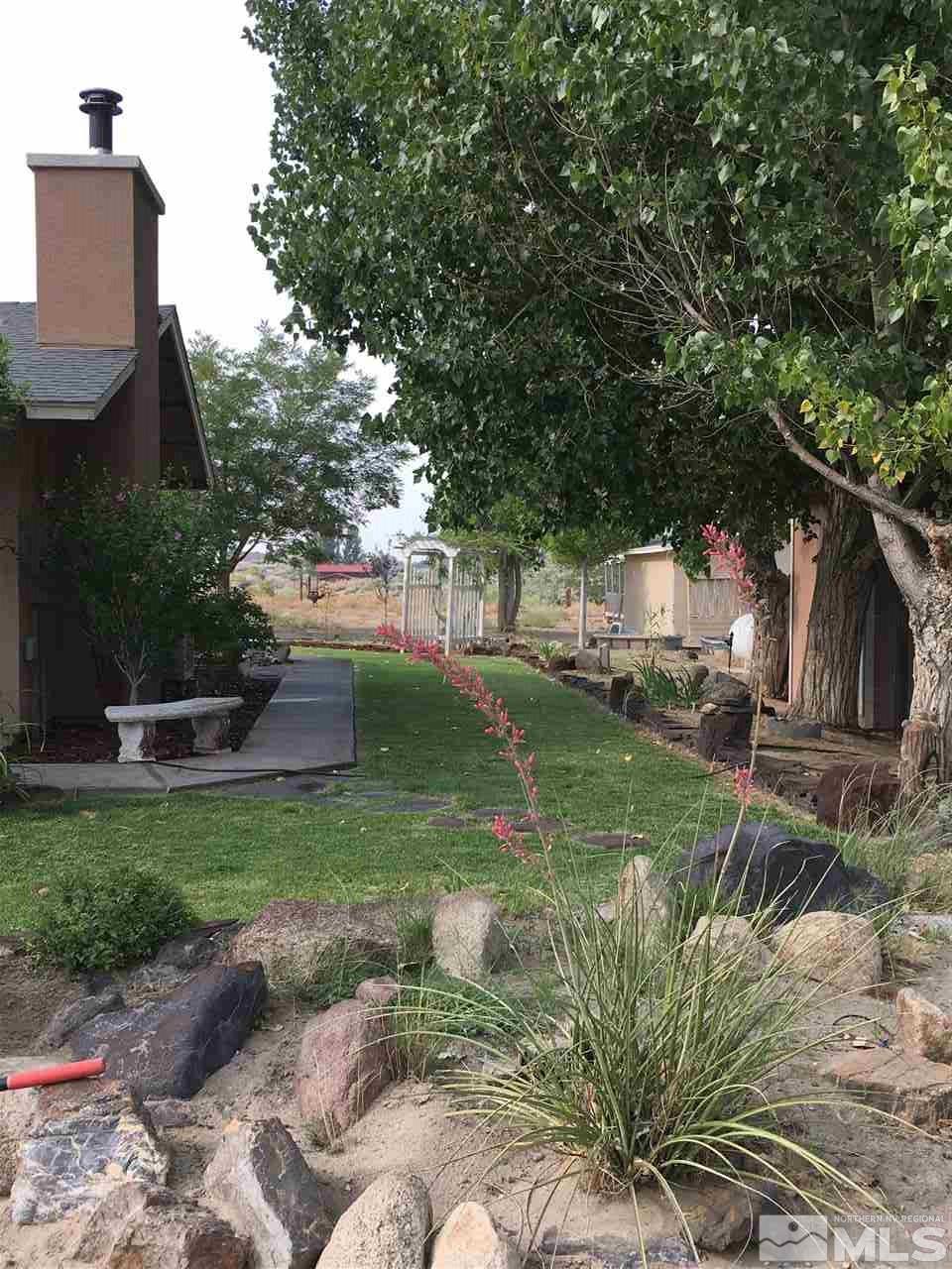6282 Power Line Road Fallon, NV 89406 - Photo 4 of 13 a backyard of a house with seating space