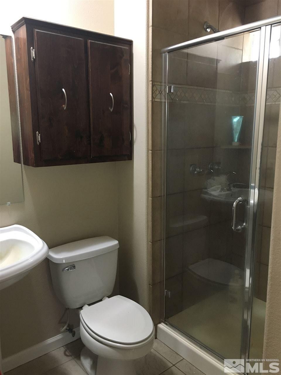 6282 Power Line Road Fallon, NV 89406 - Photo 10 of 13 a bathroom with a toilet and a shower