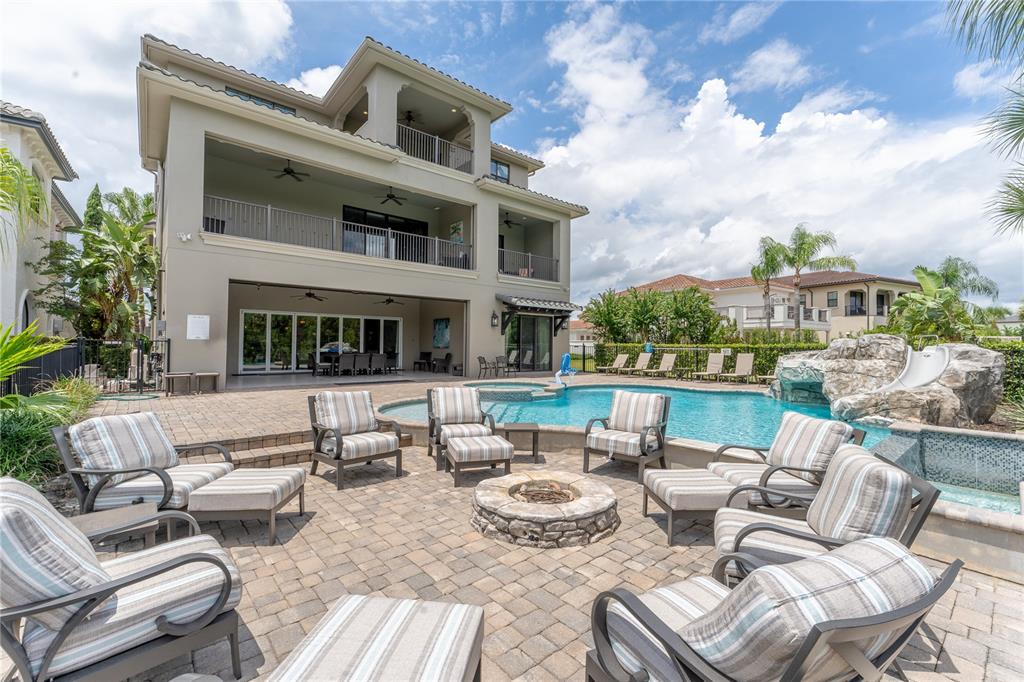 600 Muirfield Loop Reunion, FL 34747 - Photo 2 of 95 a view of a patio with couches chairs and a potted plant