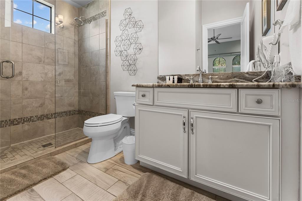 600 Muirfield Loop Reunion, FL 34747 - Photo 30 of 95 a bathroom with a toilet sink and shower