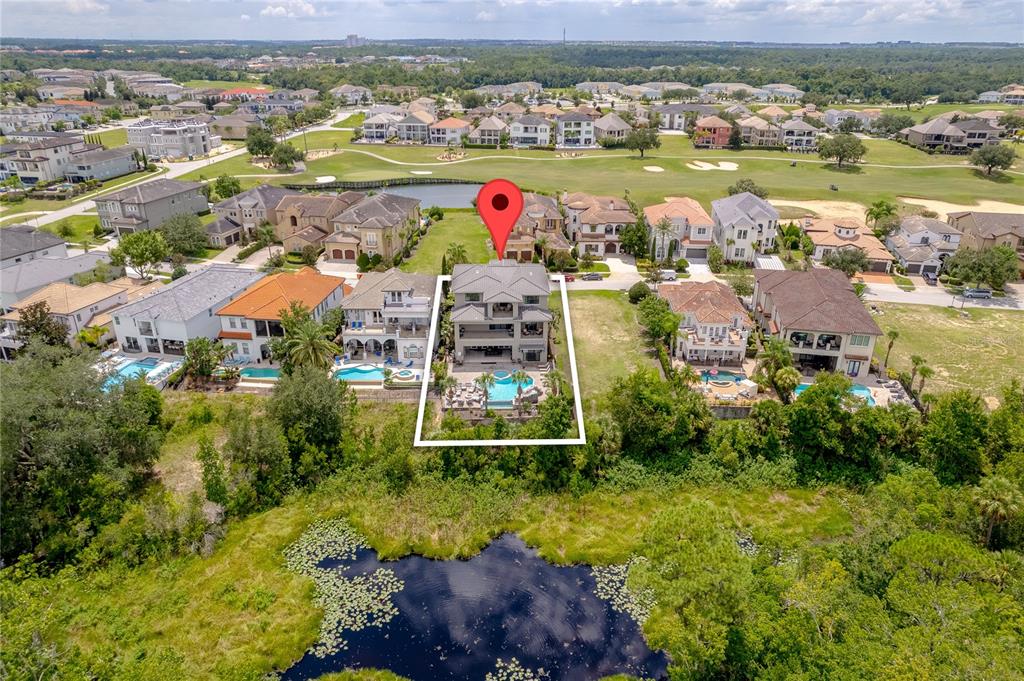 600 Muirfield Loop Reunion, FL 34747 - Photo 4 of 95 an aerial view of residential houses with outdoor space and lake view