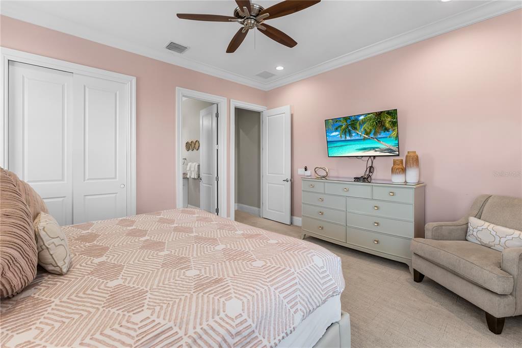 600 Muirfield Loop Reunion, FL 34747 - Photo 77 of 95 a bedroom with a bed and a couch