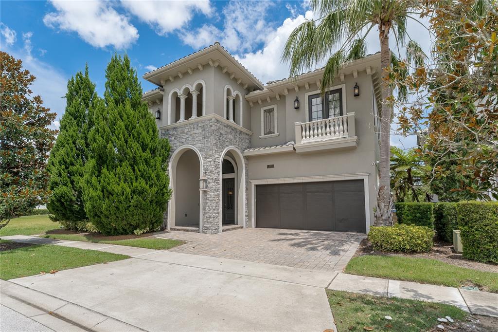 600 Muirfield Loop Reunion, FL 34747 - Photo 82 of 95 a front view of a house with yard and trees