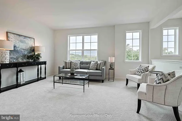 a living room with furniture and windows
